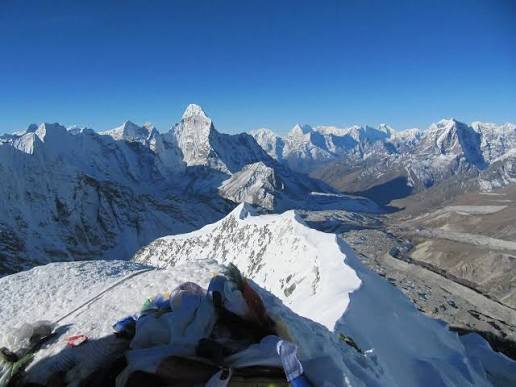 Climbers on the glacier below the headwall of Island Peak at 6,189m above Chhukung, Nepal
