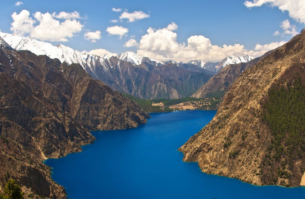 Turquoise Phoksundo Lake and Ringmo village in Shey Phoksundo National Park, Dolpo, Nepal